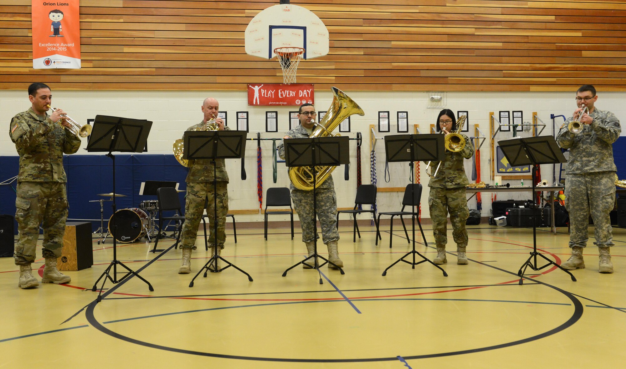 The 9th Army Band group ‘Frigid Brass’ performs for the children of Orion Elementary School, Joint Base Elmendorf-Richardson, Alaska, Feb. 21, 2017. ‘Frigid Brass’ performed many different genres of music and taught the children the first steps in playing each instrument to spark an interest in the musical arts. 