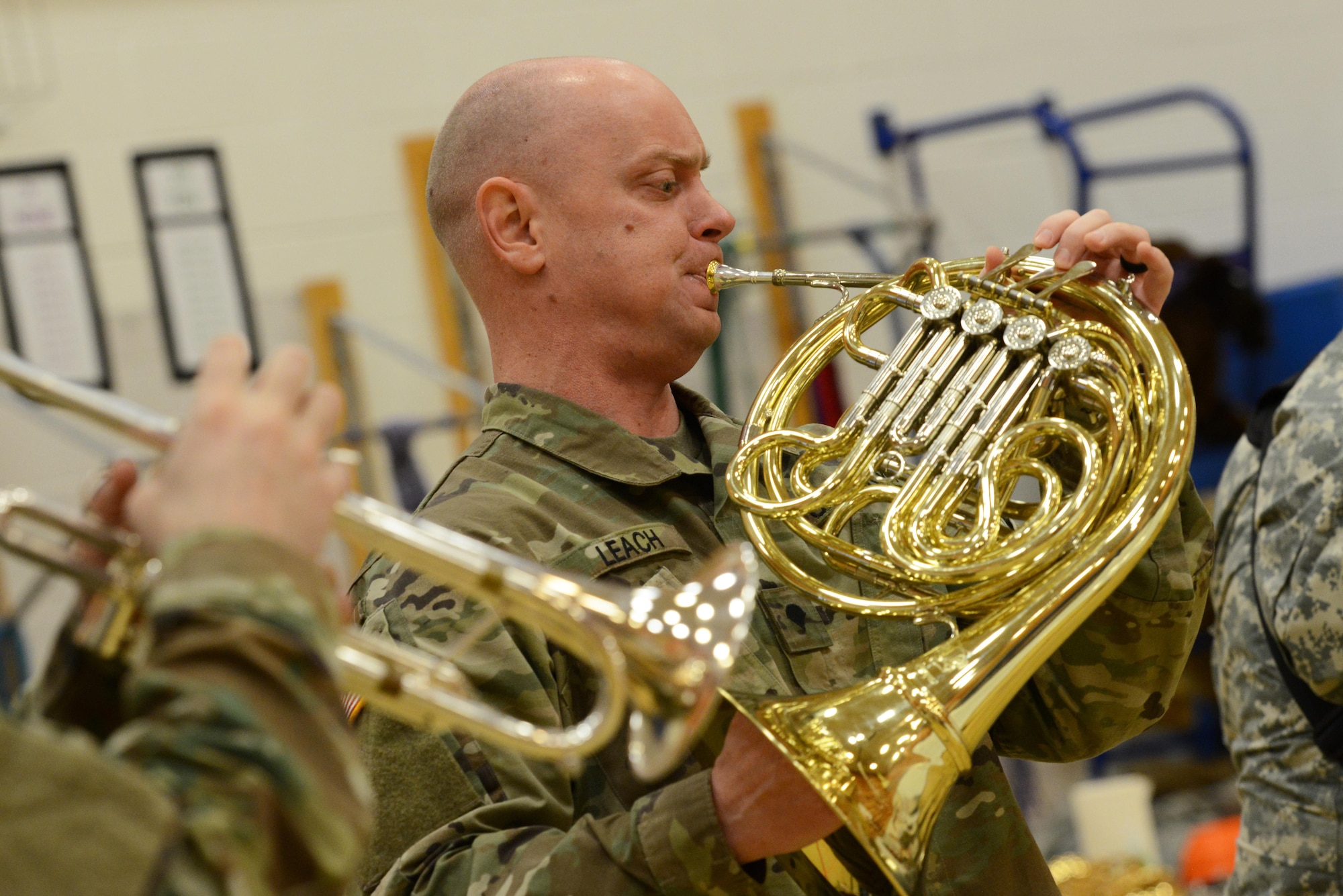 Specialist Jeremy Leach, horn player for the 9th Army Band group ‘Frigid Brass,’ performs for the children of Orion Elementary School, Joint Base Elmendorf-Richardson, Alaska, Feb. 21, 2017. ‘Frigid Brass’ performed many different genres of music and taught the children the first steps in playing each instrument to spark an interest in the musical arts. 