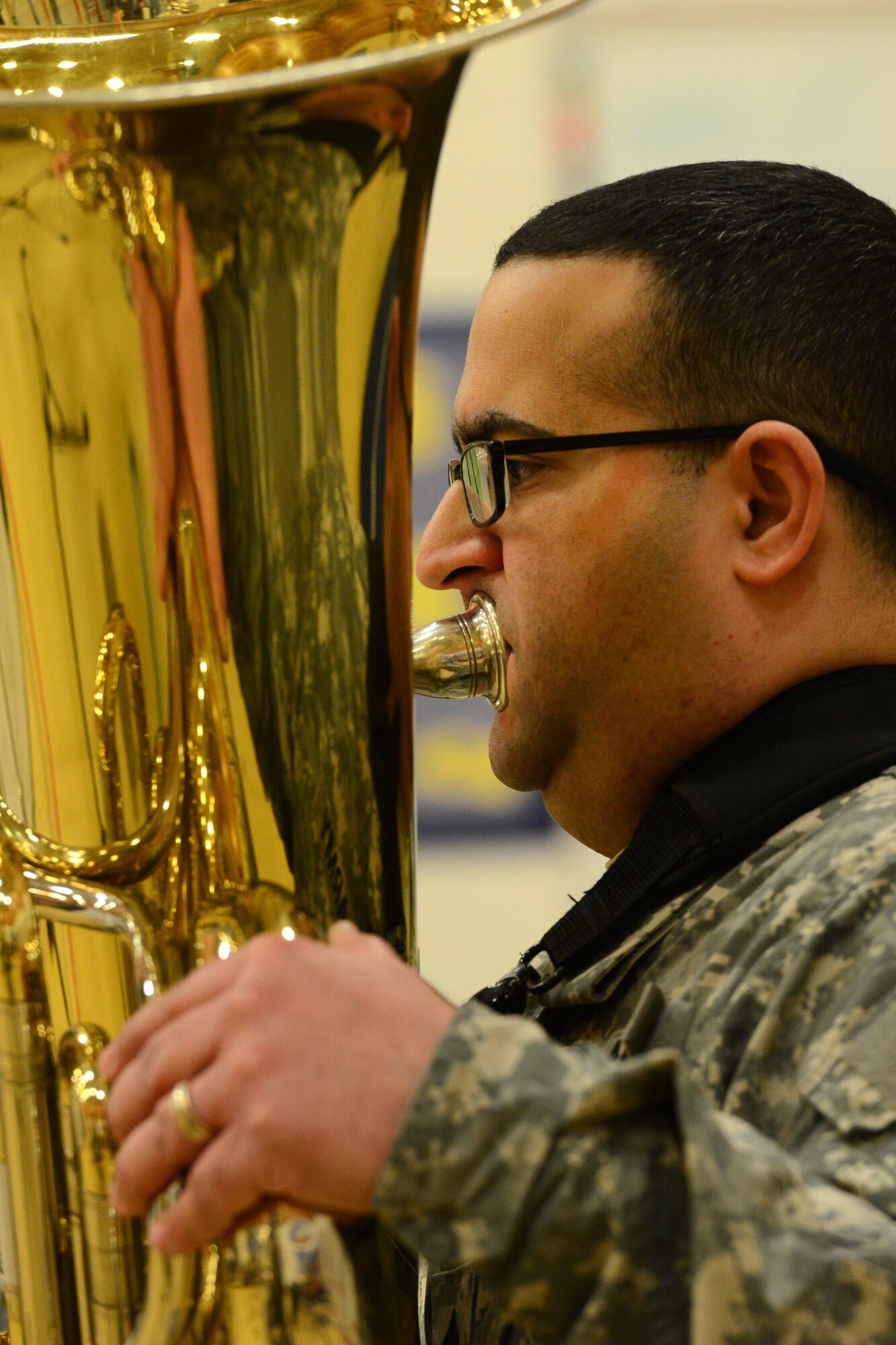 Army Sgt. Jose Lopez-Ramos, tuba player for the 9th Army Band group ‘Frigid Brass,’ performs for the children of Orion Elementary School, Joint Base Elmendorf-Richardson, Alaska, Feb. 21, 2017. ‘Frigid Brass’ performed many different genres of music and taught the children the first steps in playing each instrument to spark an interest in the musical arts. 