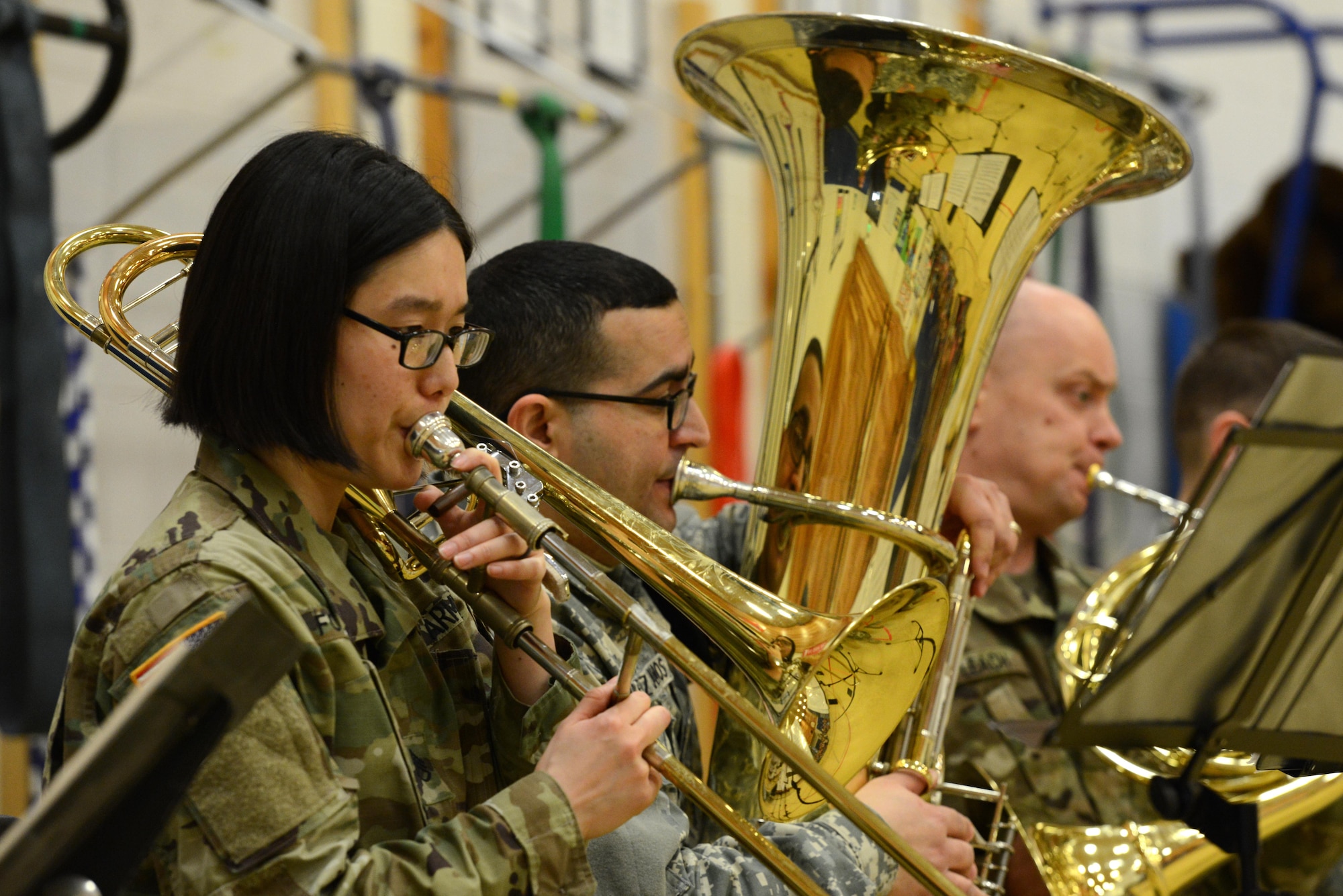 Army Staff Sgt. Nami Fowler, trombone player for the 9th Army Band group ‘Frigid Brass,’ performs for the children of Orion Elementary School, Joint Base Elmendorf-Richardson, Alaska, Feb. 21, 2017. ‘Frigid Brass’ performed many different genres of music and taught the children the first steps in playing each instrument to spark an interest in the musical arts. 