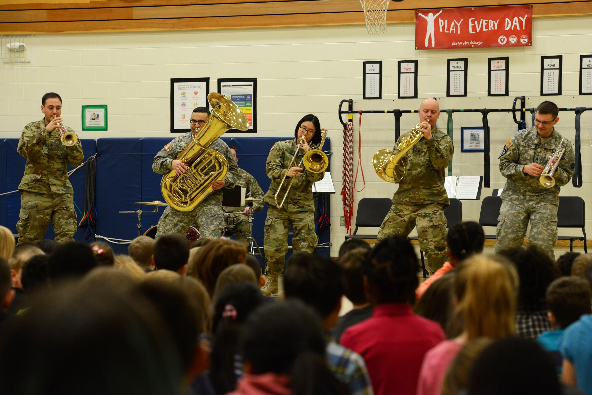 The 9th Army Band group ‘Frigid Brass’ performs for the children of Orion Elementary School, Joint Base Elmendorf-Richardson, Alaska, Feb. 21, 2017. ‘Frigid Brass’ performed many different genres of music and taught the children the first steps in playing each instrument to spark an interest in the musical arts.