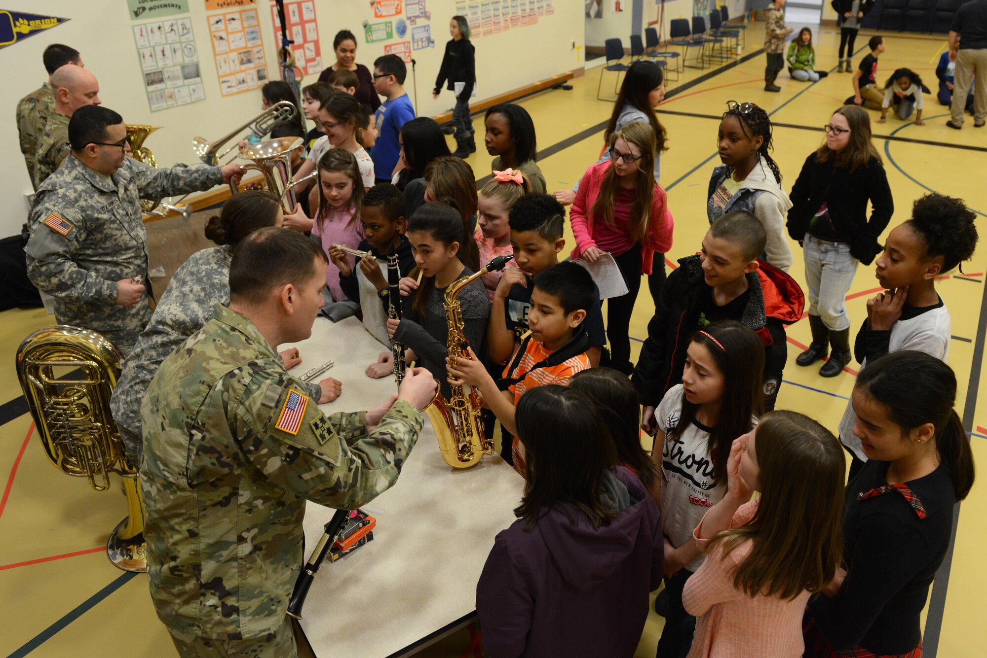 The 9th Army Band group ‘Frigid Brass’ teach 4th and 5th graders how to play different instruments at Orion Elementary School, Joint Base Elmendorf-Richardson, Alaska, Feb. 21, 2017. ‘Frigid Brass’ performed many different genres of music and taught the children the first steps in playing each instrument to spark an interest in the musical arts. 