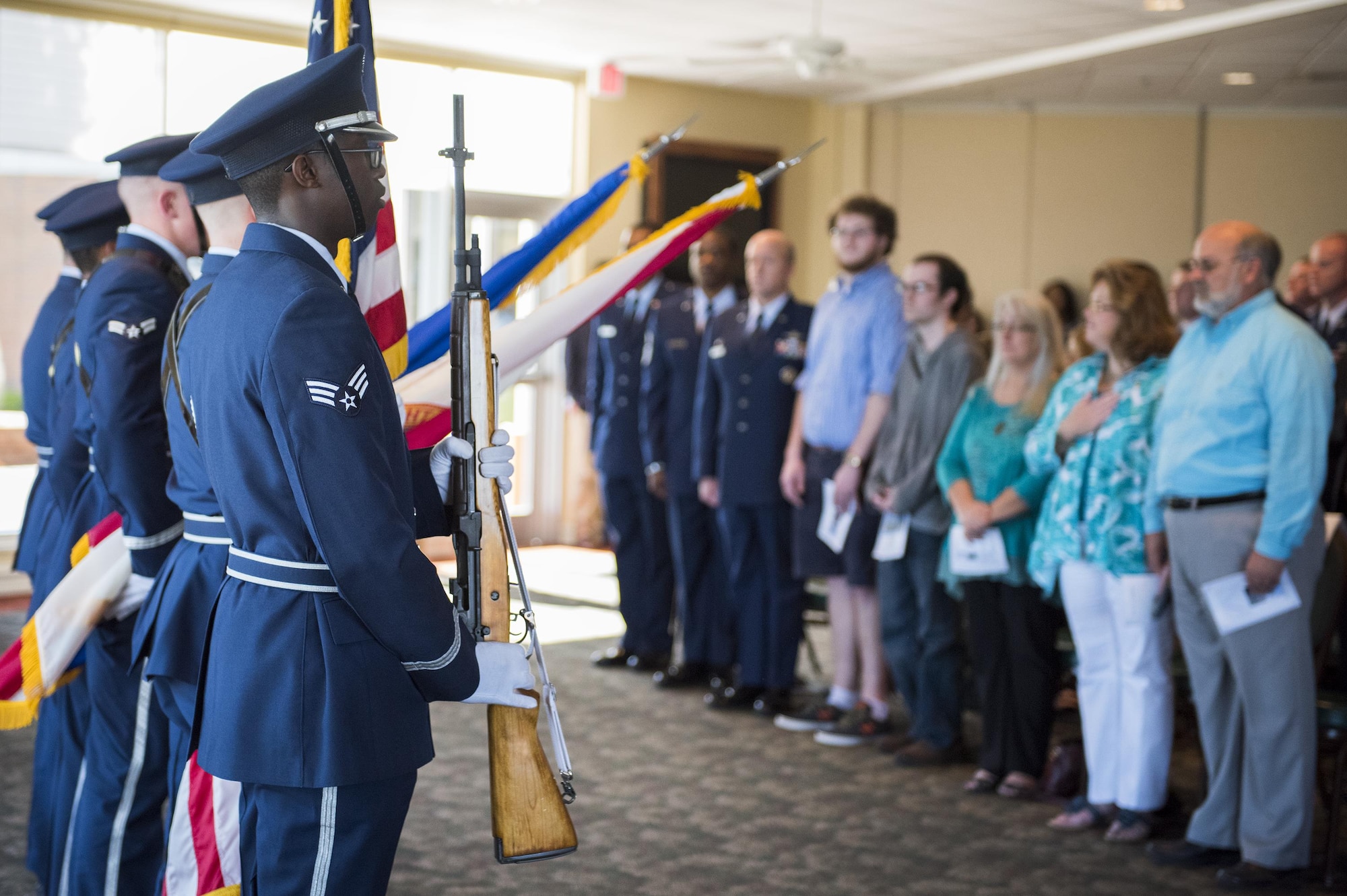 Members of Senior Airman Nathan Sartain’s family watch as the base honor guard presents the colors during a 96th Security Forces Squadron boat-dedication ceremony Feb. 24 at Eglin Air Force Base, Fla.  Sartain, a security forces Airman from Pensacola, died in an aircraft crash while deployed in 2015.  The newest patrol boat in the Eglin fleet bears his name to honor his service and sacrifice. (U.S. Air Force photo/Samuel King Jr.)