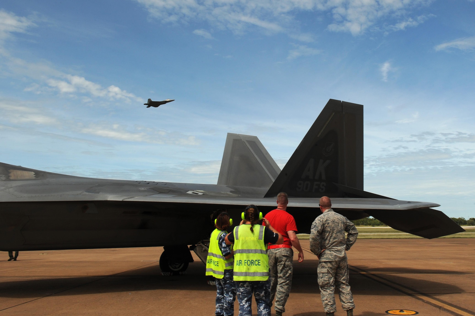U.S. and Royal Australian Air Force maintenance airmen watch as an F-22 Raptor takes off at RAAF Base Tindal, Australia, Feb. 24, 2017. Twelve F-22 Raptors and approximately 200 U.S. Air Force Airmen are in Australia as part of the Enhanced Air Cooperation, an initiative under the Force Posture Agreement between the U.S. and Australia. (U.S. Air Force photo by Staff Sgt. Alexander Martinez)