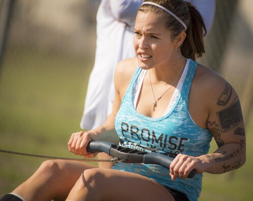 A competitor pulls at a seated cable row machine during the Eglin’s Fittest competition Feb. 25 at Eglin Air Force Base, Fla.  Male and female challengers fought to complete weightlifting, cardio and callisthenic exercises over a timed period.  The person with the most points (earned through reps and quickness) earned the title of “Eglin’s Fittest”.  (U.S. Air Force photo/Samuel King Jr.)