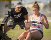 A competitor pulls at a seated cable row machine during the Eglin’s Fittest competition Feb. 25 at Eglin Air Force Base, Fla.  Male and female challengers fought to complete weightlifting, cardio and callisthenic exercises over a timed period.  The person with the most points (earned through reps and quickness) earned the title of “Eglin’s Fittest”.  (U.S. Air Force photo/Samuel King Jr.)
