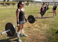 Four competitors perform deadlifts during the Eglin’s Fittest competition Feb. 25 at Eglin Air Force Base, Fla.  Male and female challengers fought to complete weightlifting, cardio and callisthenic exercises over a timed period.  The person with the most points (earned through reps and quickness) earned the title of “Eglin’s Fittest”.  (U.S. Air Force photo/Samuel King Jr.)