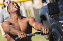 A competitor struggles for one final rep at a seated cable row machine during the Eglin’s Fittest competition Feb. 25 at Eglin Air Force Base, Fla.  Male and female challengers fought to complete weightlifting, cardio and callisthenic exercises over a timed period.  The person with the most points (earned through reps and quickness) earned the title of “Eglin’s Fittest”.  (U.S. Air Force photo/Samuel King Jr.)