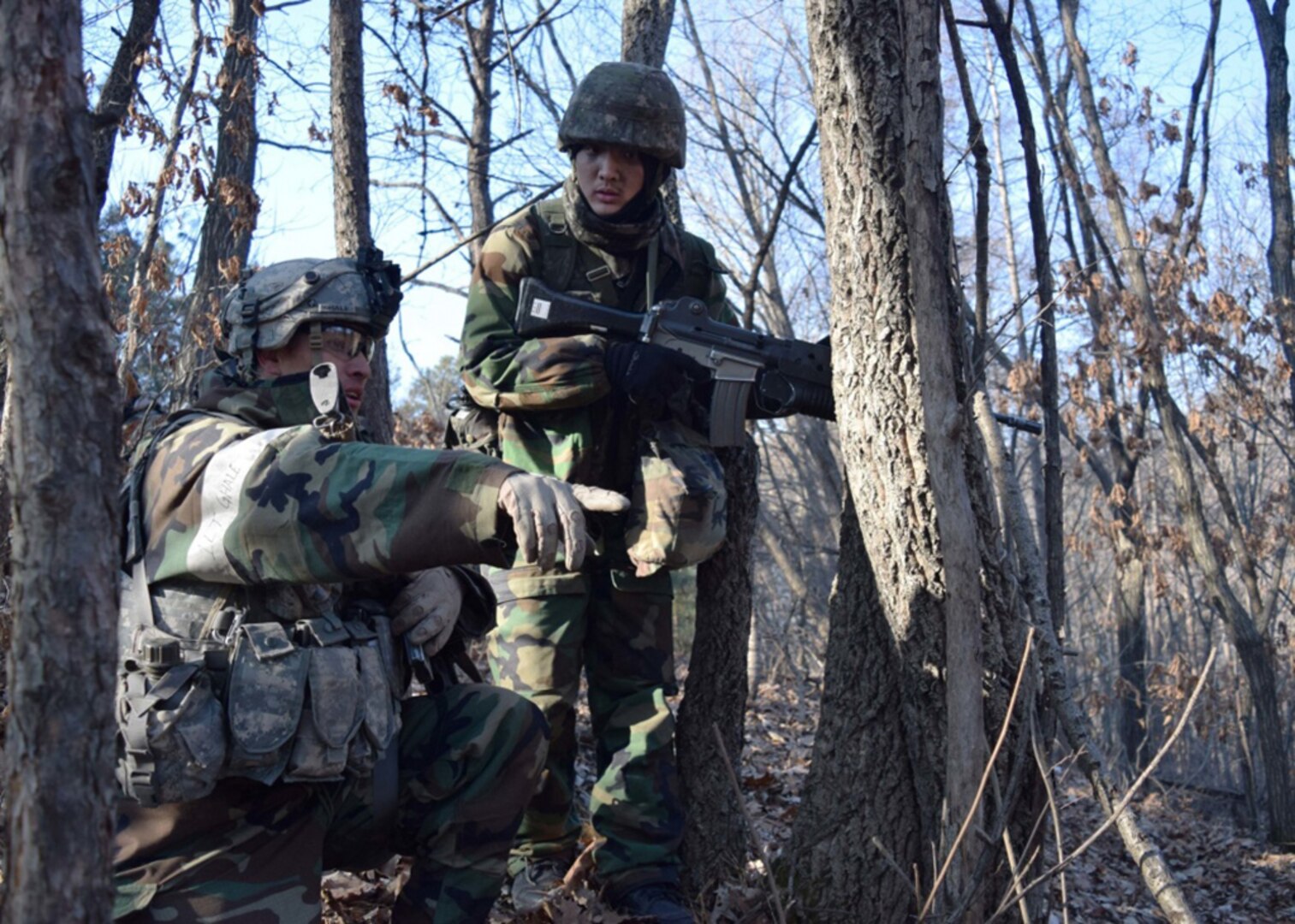 A U.S. Army Soldier from 1st Battalion, 16th Infantry Regiment, 1st Armored Brigade Combat Team, 1st Infantry Division, coordinates movement with a South Korean Army soldier during exercise Warrior Strike 5 at the Rodriguez Live Fire Complex in Pocheon, South Korea Feb. 16, 2017. The four-day long exercise included more Republic of Korea Army soldiers than any previous Warrior Strike exercise. 