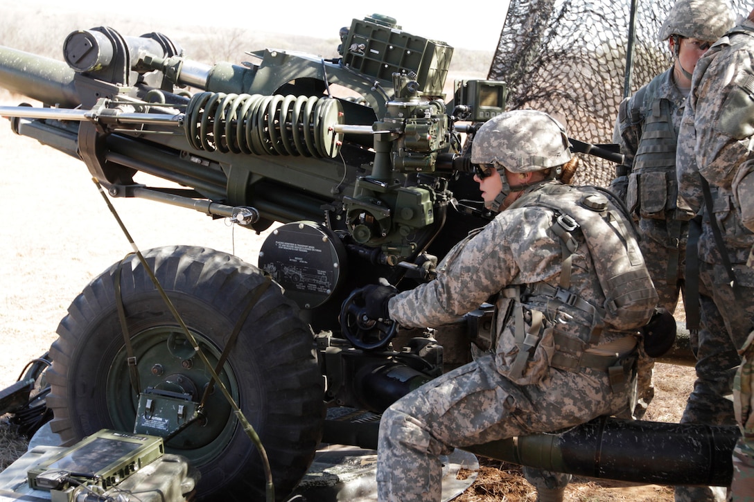 Army Pfc. Katherine Beatty takes her turn at the M119A3 howitzer during final advanced individual training at Fort Sill, Okla., March 1, 2016. Beatty is the Army’s first female 13B cannon crewmember to graduate from advanced individual training, taught in 1st Battalion, 78th Field Artillery. Army photo by Cindy McIntyre