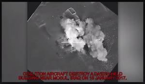 Coalition aircraft destroy a Da'esh-held building during a strike near Mosul, Iraq on 18 Jan. This strike was just a small part of the impact that the Targeting Team makes in order to support the ISF maneuver plan. (Photo Credit: (Courtesy photo))