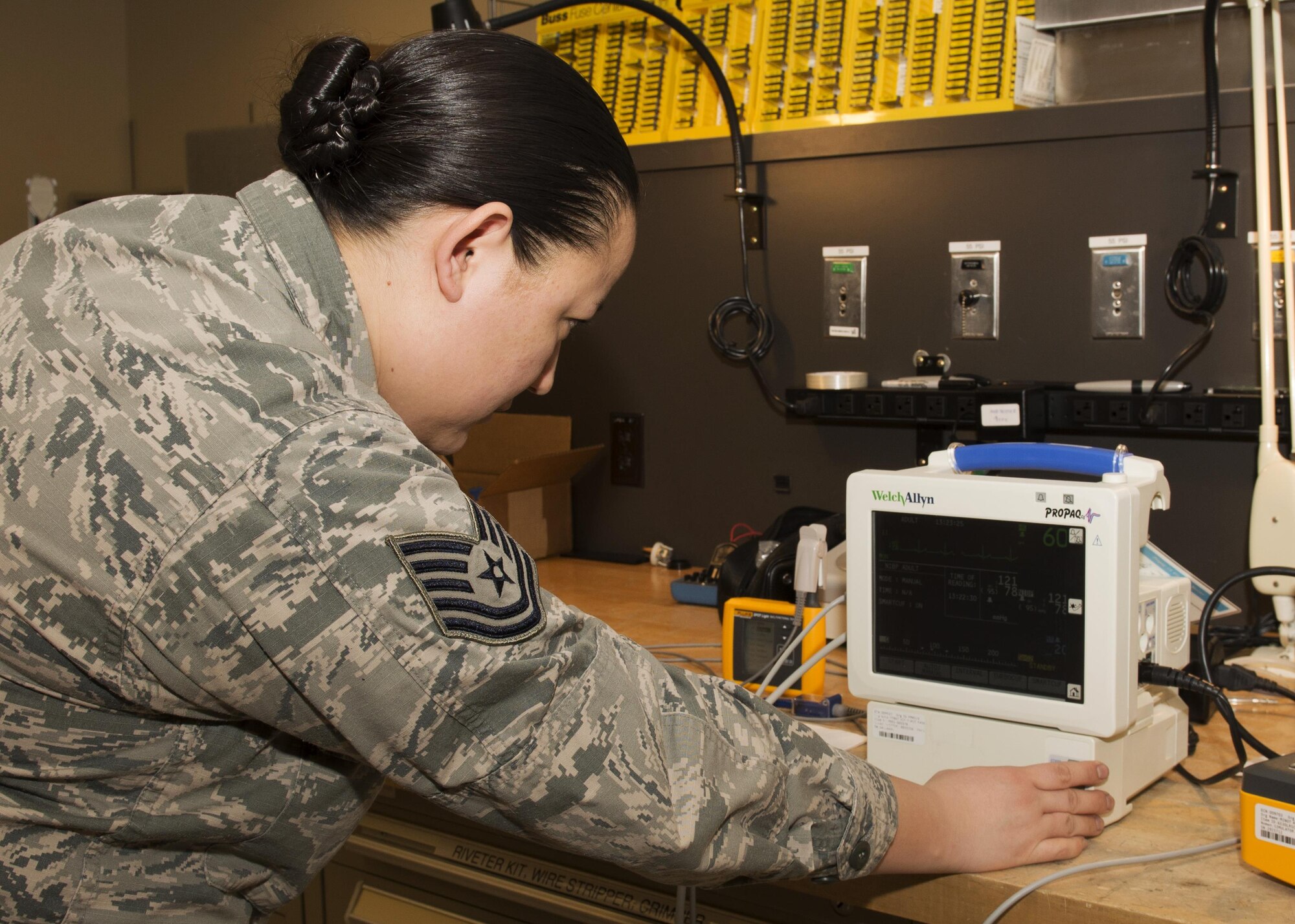 Tech. Sgt. Linsey McCluskey, 5th Medical Support Squadron medical maintenance NCO-in-charge, tests a vital signs monitor for accuracy at the 5th Medical Group clinic at Minot Air Force Base, N.D., Feb. 8, 2017. The monitor is used in almost every appointment made on base to check the heart rate, blood pressure and temperature of a patient. (U.S. Air Force photo/Airman 1st Class Alyssa M. Akers)