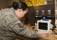Tech. Sgt. Linsey McCluskey, 5th Medical Support Squadron medical maintenance NCO-in-charge, tests a vital signs monitor for accuracy at the 5th Medical Group clinic at Minot Air Force Base, N.D., Feb. 8, 2017. The monitor is used in almost every appointment made on base to check the heart rate, blood pressure and temperature of a patient. (U.S. Air Force photo/Airman 1st Class Alyssa M. Akers)