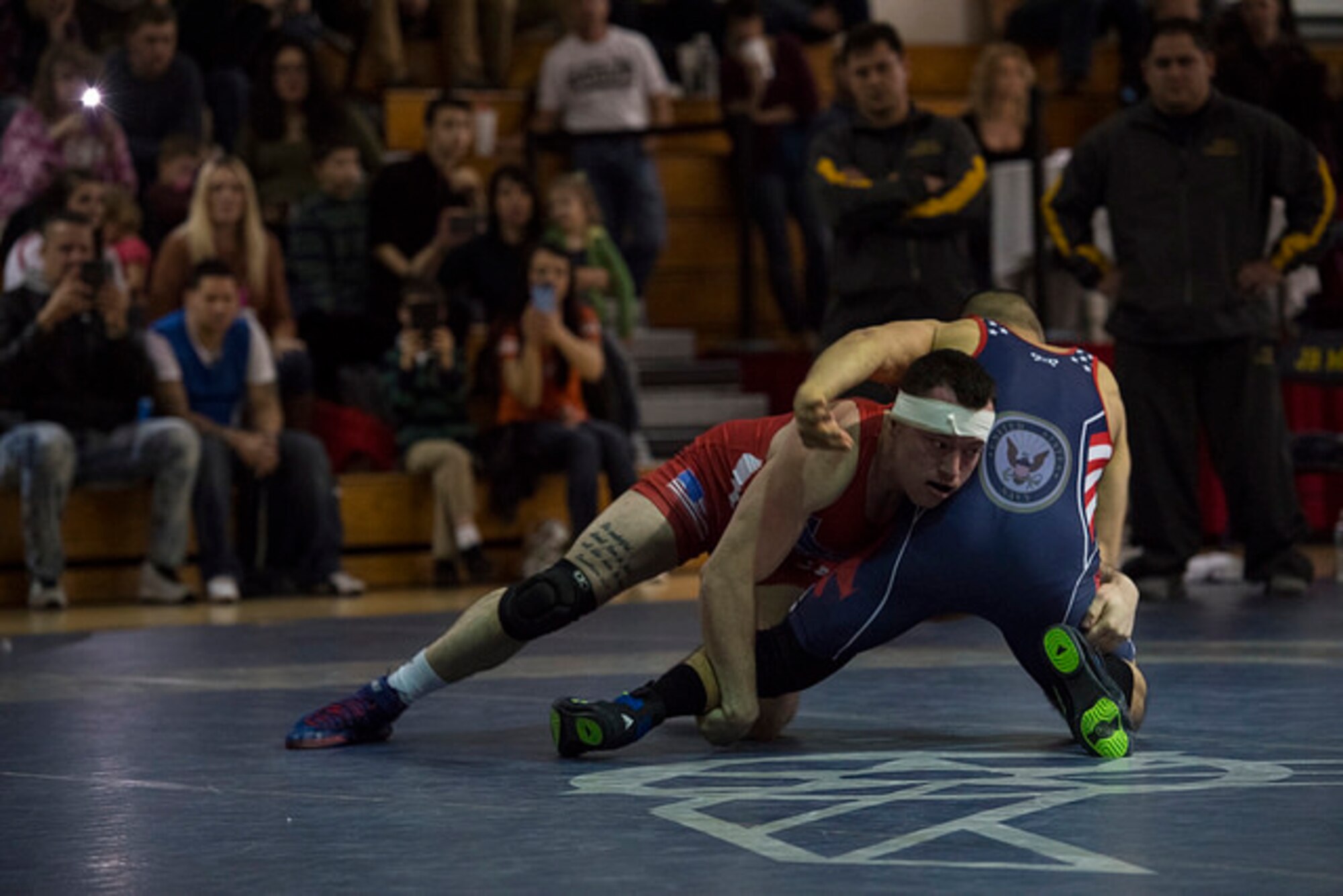 Airman 1st Class Tyler Westlund, 88th Air Base Wing military personnel section technician, wrestles against the Navy during the Armed Forces Wrestling Championship on Joint Base McGuire-Dix-Lakehurst, N.J. Feb. 26. Westlund finished third in the Roman Greco competition and was unable to finish the Freestyle competition due to injury. 