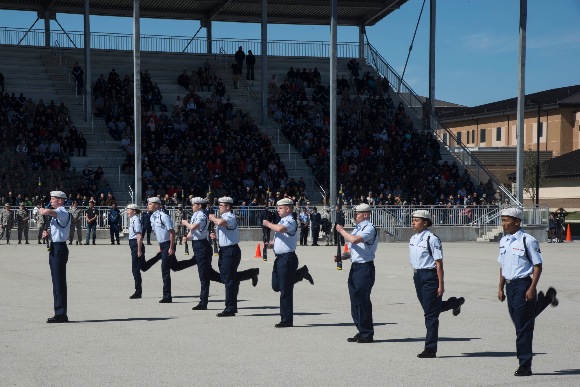 Members of the 59th Training Group drill team perform in the freestyle round of the 37th Training Wing Drill Down Invitational at the Pfingston Reception Center at Joint Base San Antonio-Lackland, Texas, Feb. 25, 2017. The 59th Training Group included a team of nine Airmen enrolled in technical training at Joint Base San Antonio-Fort Sam Houston. 