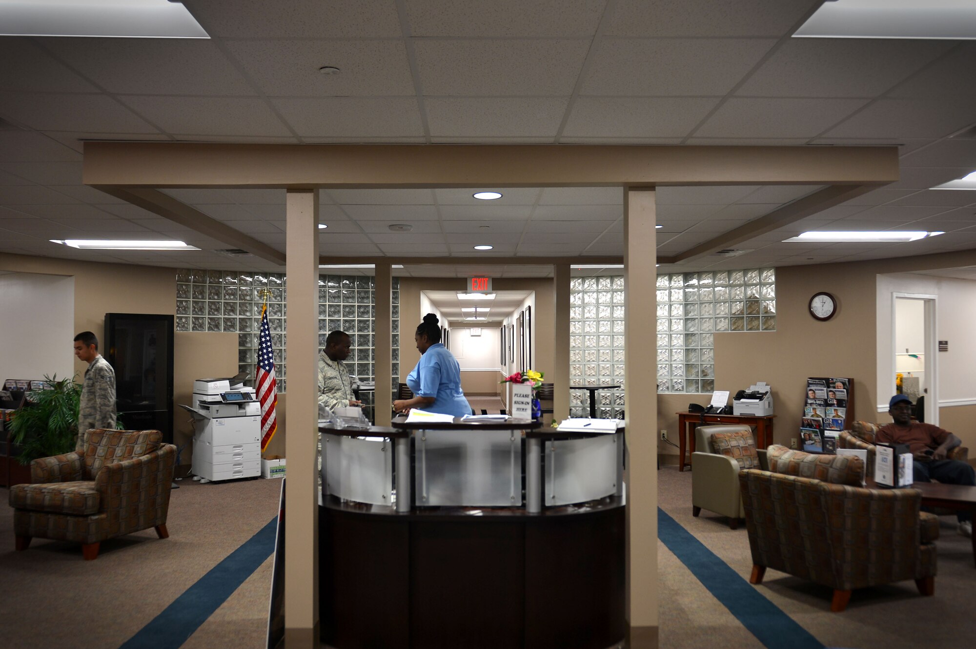Patricia House-Dumas, 20th Force Support Squadron Airman and Family Readiness Center community service specialist, assists U.S. Airmen at Shaw Air Force Base, S.C., Feb. 22, 2017. Along with the services returning to the main site, the A&FRC has received a makeover consisting of new furniture, lighting and carpeting. (U.S. Air Force photo by Airman 1st Class Christopher Maldonado)