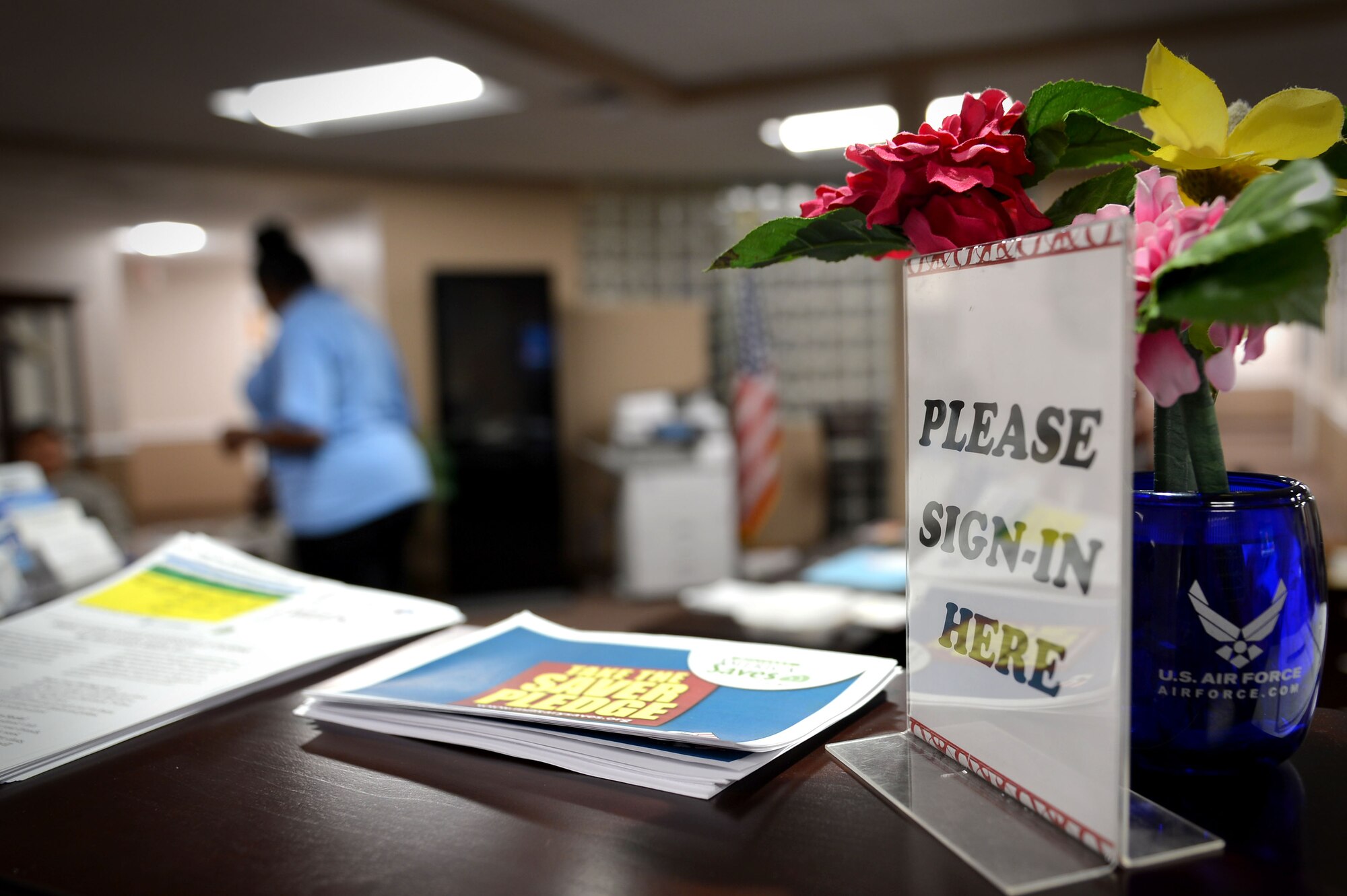 A Team Shaw member assigned to the 20th Force Support Squadron Airman and Family Readiness Center (A&FRC) assists a customer at Shaw Air Force Base, S.C., Feb. 22, 2017. The A&FRC was closed for renovations and is now up and running, providing its services to the military members, dependents and retirees on base. (U.S. Air Force photo by Airman 1st Class Christopher Maldonado)