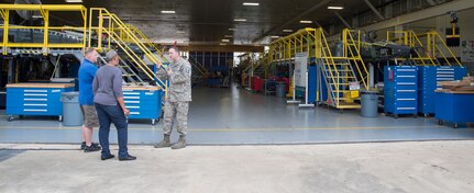 Master Sgt. Ryan Love (right), Air Education and Training Command equipment manager, speaks with Bryan Kammerdiener, 575th Aircraft Maintenance Squadron engineering technician, and Sharon Walker, 502nd Logistics Readiness Squadron equipment accountability element technician, outside an aircraft maintenance hangar Feb. 27 at Joint Base San Antonio-Randolph. Love was recently awarded the AETC Outstanding Air Force Logistics Readiness Enlisted Staff of the Year honor. (U.S. Air Force photo by Airman 1st Class Lauren Parsons/Released)