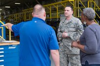 Master Sgt. Ryan Love (center), Air Education and Training Command equipment manager, speaks with Bryan Kammerdiener, 575th Aircraft Maintenance Squadron engineering technician, and Sharon Walker, 502nd Logistics Readiness Squadron equipment accountability element technician, outside an aircraft maintenance hangar Feb. 27 at Joint Base San Antonio-Randolph. Love was recently awarded the AETC Outstanding Air Force Logistics Readiness Enlisted Staff of the Year honor. (U.S. Air Force photo by Airman 1st Class Lauren Parsons/Released)