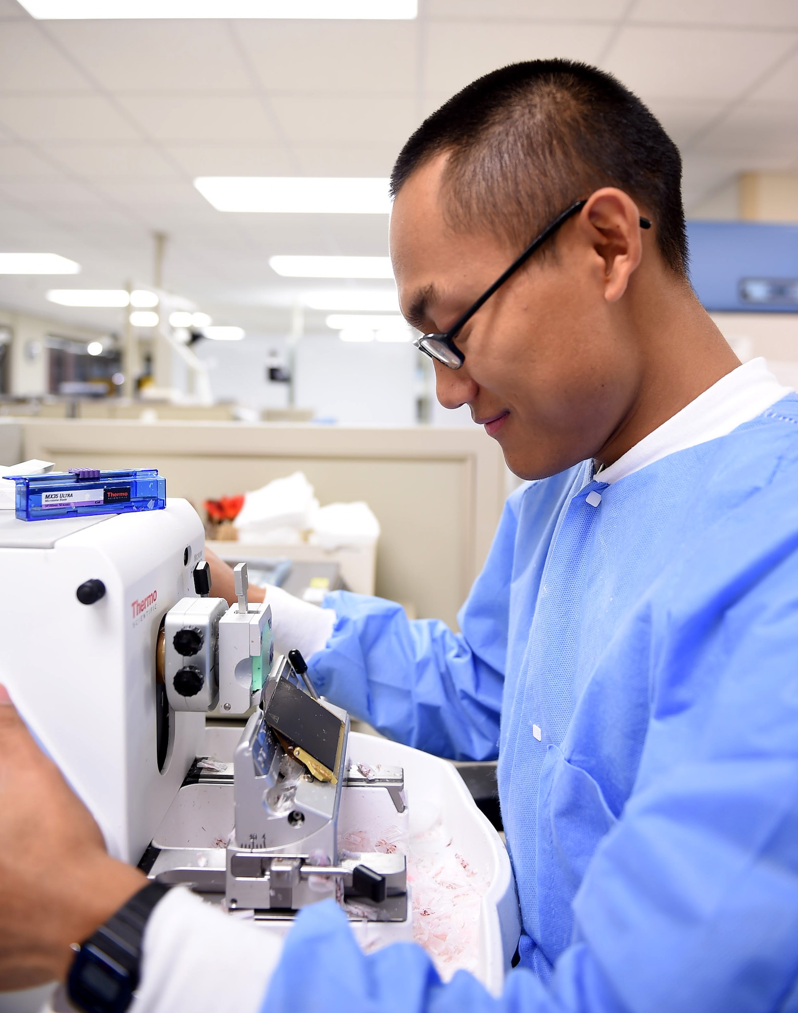 Senior Airman Biak Sang, a 959th Clinical Support Squadron histology technician, preps a block tissue sample for testing at the San Antonio Military Medical Center, Joint Base San Antonio-Fort Sam Houston, Jan. 13, 2017. The pathology lab is part of the 959th Medical Group, the third largest medical group in the Air Force Medical Service. The group is fully integrated with Army and civilian personnel at SAMMC, supporting operations at a 425-bed facility and the only Level 1 Trauma Center in the Department of Defense (U.S. Air Force photo/Staff Sgt. Jerilyn Quintanilla) 