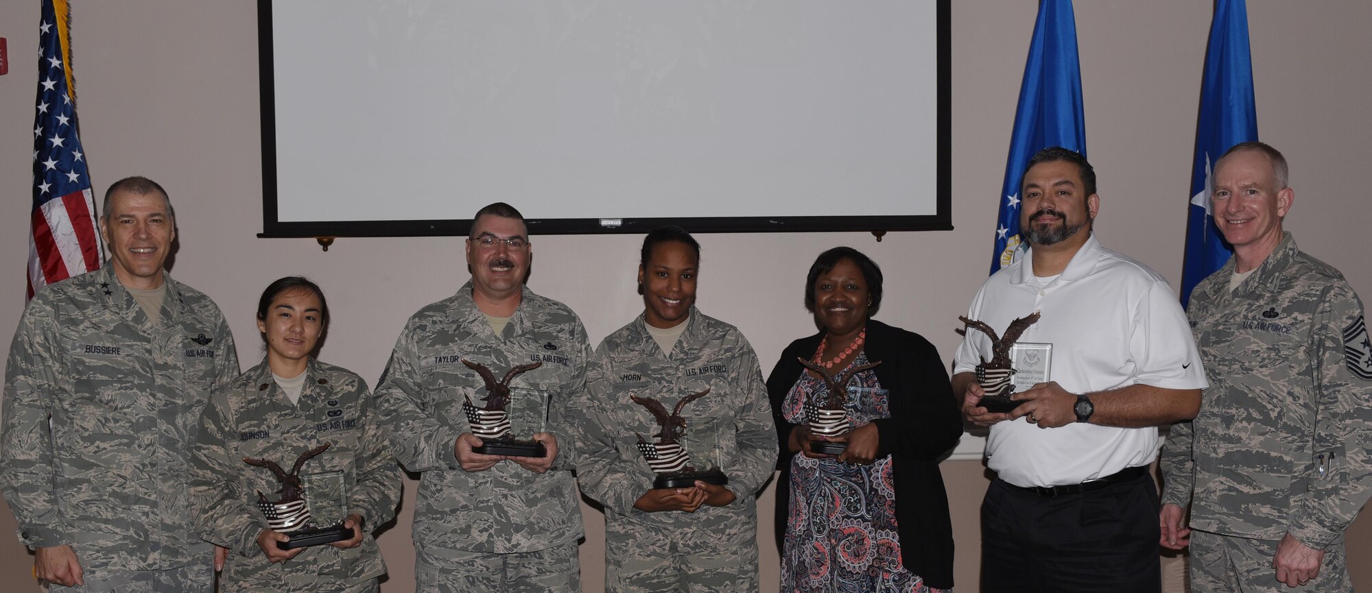 Mighty Eighth Airmen are recognized as 2016 Headquarters Eighth Air Force Annual Awards winners during a ceremony held at Barksdale Air Force Base, La., Feb. 27, 2017. Maj. Gen. Thomas Bussiere, Eighth Air Force commander, and Chief Master Sgt. Alan Boling, Eighth Air Force command chief, presented awards to Airmen and civilians assigned to Headquarters Eighth Air Force to recognize their professionalism and successes throughout the year. (U.S. Air Force photo by Senior Airman Erin Trower)