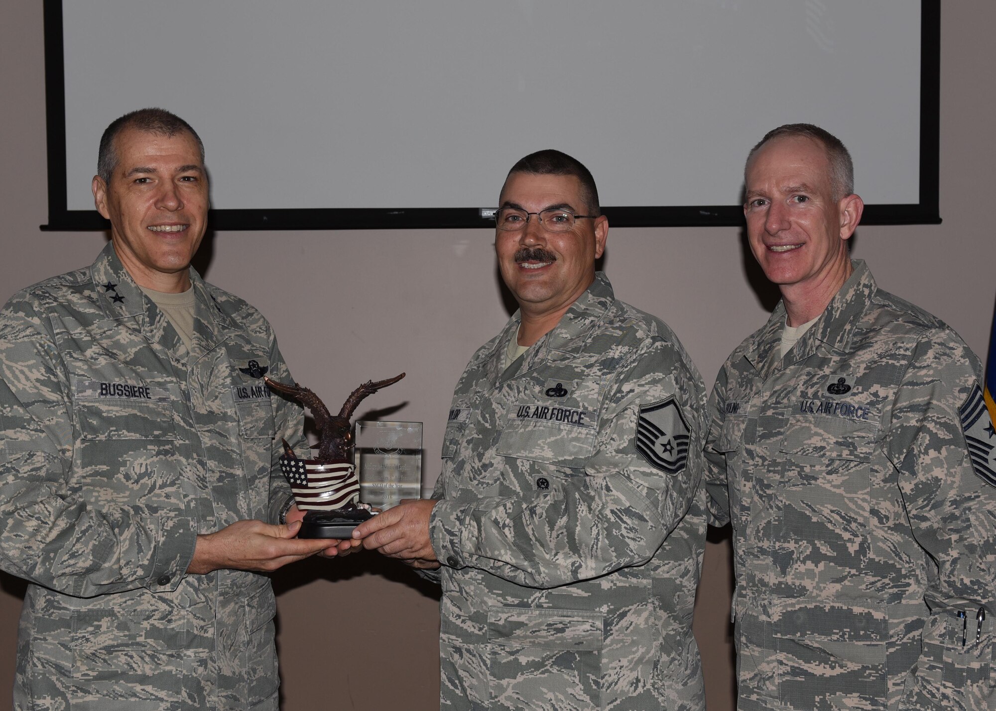 U.S. Air Force Master Sgt. Michael Taylor, 608th Strategic Operations Squadron, is named Senior Noncommissioned of the Year during the 2016 Headquarters Eighth Air Force Annual Awards ceremony at Barksdale Air Force Base, La., Feb. 27, 2017. Maj. Gen. Thomas Bussiere, Eighth Air Force commander, and Chief Master Sgt. Alan Boling, Eighth Air Force command chief, presented awards to Airmen and civilians assigned to Headquarters Eighth Air Force to recognize their professionalism and successes throughout the year. (U.S. Air Force photo by Senior Airman Erin Trower)