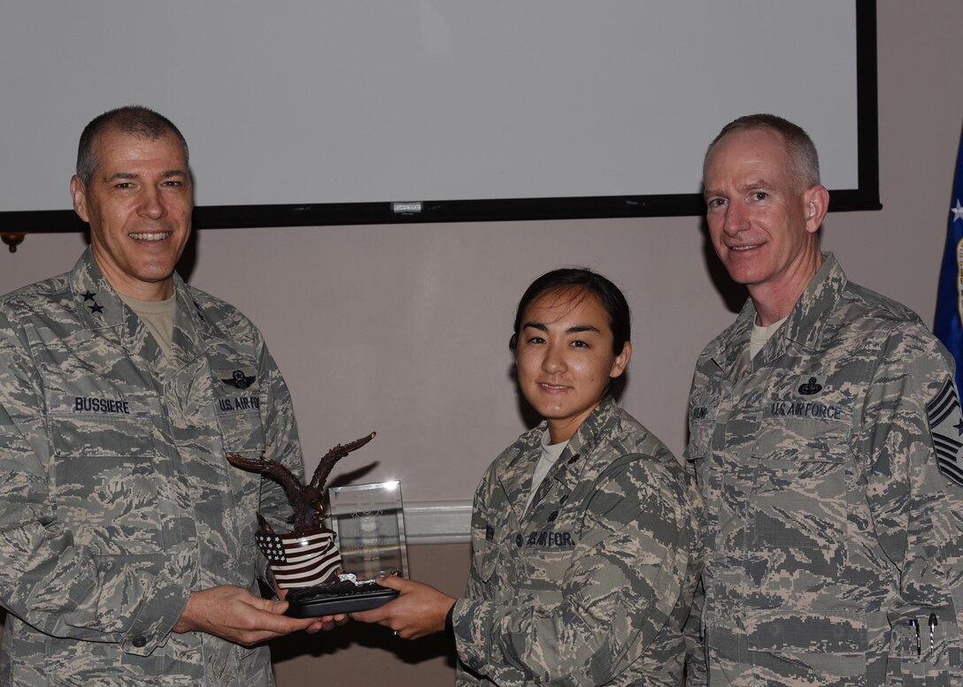 U.S. Air Forces Maj. Tiffany Johnson, Headquarters Eighth Air Force judge advocate, is named Company Grade Officer of the Year during the 2016 Headquarters Eighth Air Force Annual Awards ceremony at Barksdale Air Force Base, La., Feb. 27, 2017. Maj. Gen. Thomas Bussiere, Eighth Air Force commander, and Chief Master Sgt. Alan Boling, Eighth Air Force command chief, presented awards to Airmen and civilians assigned to Headquarters Eighth Air Force to recognize their professionalism and successes throughout the year. (U.S. Air Force photo by Senior Airman Erin Trower)