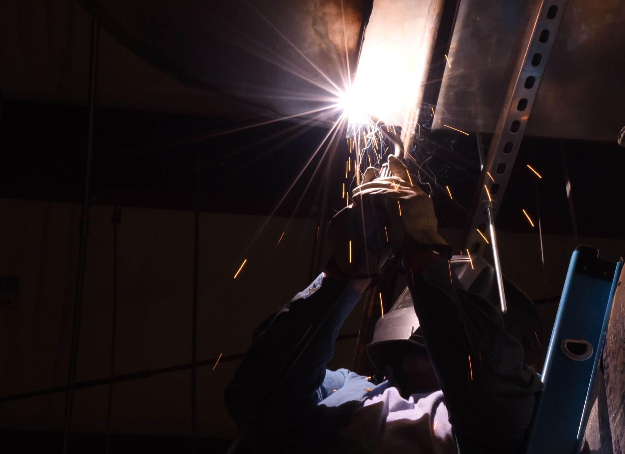 Ronnie Langford, R and R Food service installer, welds on a kitchen exhaust hood at the McBride Commons Feb. 15, 2017, on Keesler Air Force Base, Miss. The McBride Commons renovation project will transition the former base library into a common area for those with base access, which will include a children’s library, computer stations, engraving, framing, marketing and print shops and a full kitchen. The planned completion date for the nine-month project is May 2017. (U.S. Air Force photo by Kemberly Groue)