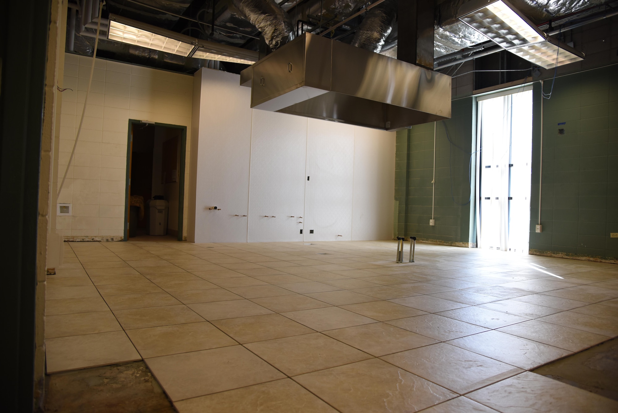 Kitchen renovations continue at the McBride Commons Feb. 23, 2017, on Keesler Air Force Base, Miss. The McBride Commons renovation project will transition the former base library into a common area for those with base access, which will include a children’s library, computer stations, engraving, framing, marketing and print shops and a full kitchen. The planned completion date for the nine-month project is May 2017. (U.S. Air Force photo by Kemberly Groue)