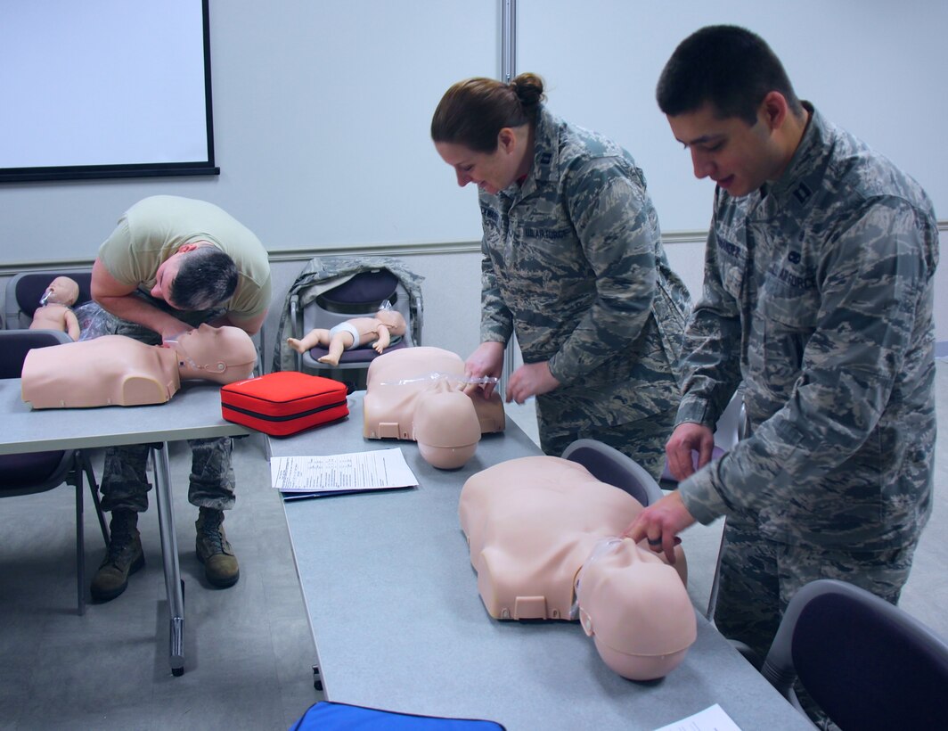 Airmen of the 932nd Airlift Wing helped each other train during the UTA (Unit Training Assembly). Basic life saving skills (BLS) were taught methodically, step by step, with instructors watching during annual Emergency Medical Technician training, inside the 932nd Medical Group. This included proper procedures for patient assessment and trauma treatment in a special class held recently at Scott Air Force Base, Ill. The 932nd Medical Group is one of four groups under the 932nd Airlift Wing, a 22nd Air Force unit and part of the Air Force Reserve Command.  (U.S. Air Force photo by Lt. Col. Stan Paregien)