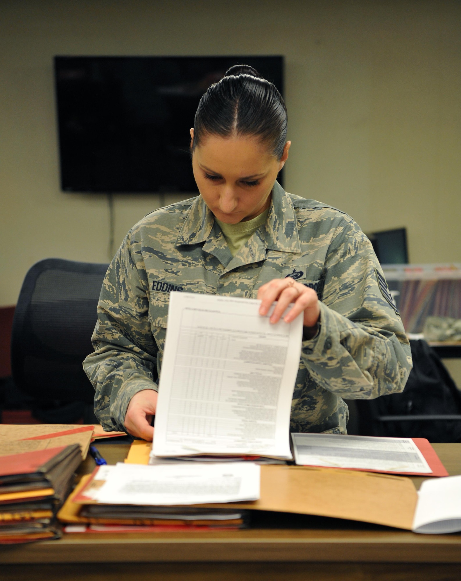 Tech. Sgt. Cassandra Eddins, 9th Force Support Squadron noncommissioned officer in charge of installation personnel readiness, reviews a completed pre-deployment checklist Feb. 22, 2017, at Beale Air Force Base, California. IPR works closely with unit deployment managers to ensure the checklists are filled out correctly by individuals deploying. (U.S. Air Force photo/Airman Tristan D. Viglianco) 