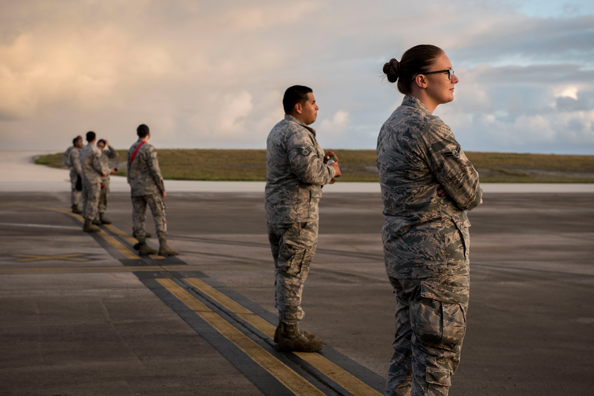 U.S. Air Force Airmen from the 67th Aircraft Maintenance Squadron form up before conducting a foreign object debris walk Feb, 23, 2017 on the flightline of Andersen Air Force Base, Guam. The 67th AMU flew from Kadena Air Base, Japan, to support one of the 22 flying units participating in annual exercise Cope North.  (U.S. Air Force photo by Senior Airman John Linzmeier)
