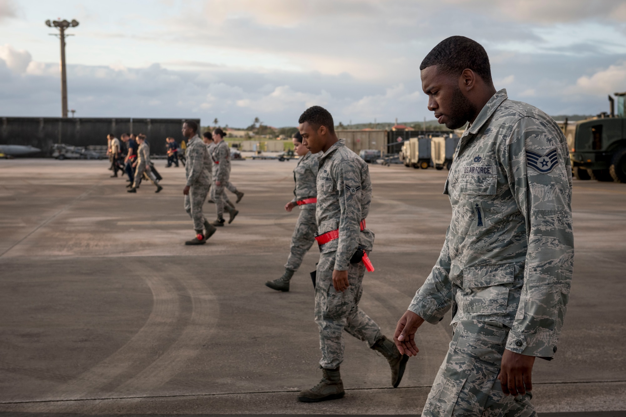 U.S. Air Force weapons Airmen from the 67th Aircraft Maintenance Squadron conduct a foreign object debris walk Feb, 23, 2017 on the flightline of Andersen Air Force Base, Guam. The 67th AMU is participating in annual exercise Cope North to increase interoperability between the U.S., Royal Australian Air Force and Japan Air Self-Defense Force. (U.S. Air Force photo by Senior Airman John Linzmeier)