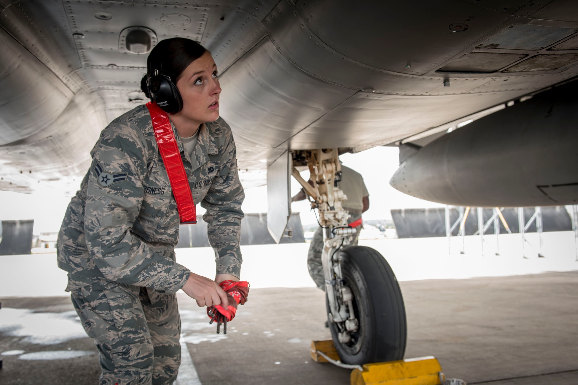 U.S. Air Force Airman 1st Class Victoria Barsness, 67th Aircraft Maintenance Squadron weapons team load member, arms an F-15 Eagle Feb. 23, 2017, at Andersen Air Force Base, Guam. Barsness is one of more than 2,700 other U.S., Australian and Japanese servicemembers participating in Cope North, an annual exercise that provides aircrew with real-time war scenarios and helps ground crews test their readiness capabilities. (U.S. Air Force photo by Senior Airman John Linzmeier)