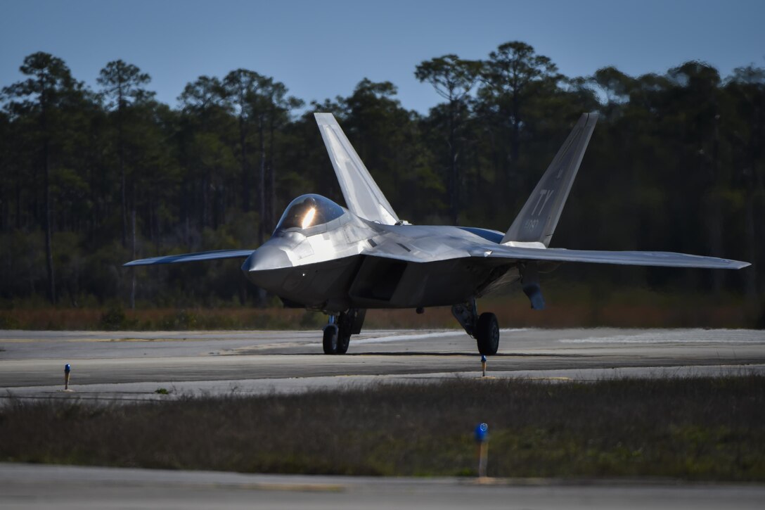 An F-22 Raptor assigned to the 95th Fighter Squadron, Tyndall Air Force Base, Fla., taxis at Hurlburt Field, Fla., Feb. 26, 2017. Forward area refueling point Air Commandos with the 1st Special Operations Logistic Readiness Squadron refueled three F-22s from an MC-130J Commando II tanker aircraft assigned to the 9th Special Operations Squadron, Cannon AFB, N.M., during the operation. (U.S. Air Force photo by Airman 1st Class Joseph Pick)