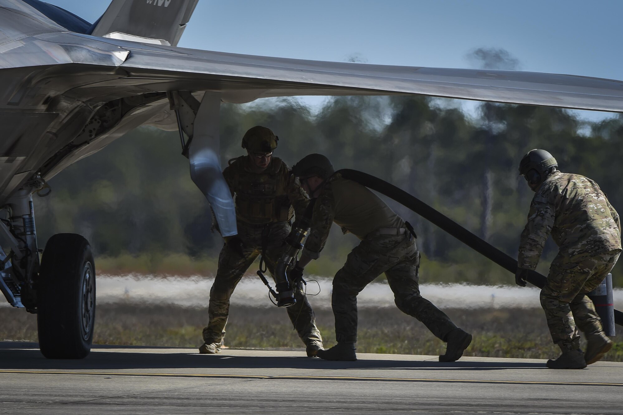 Forward area refueling point Airmen with the 1st Special Operations Logistic Readiness Squadron prepare to connect a fuel hose to an F-22 Raptor during a FARP operation at Hurlburt Field, Fla., Feb. 26, 2017. FARP Airmen perform covert nighttime refueling operations in deployed locations where fueling points are not accessible or when air-to-air refueling is not possible. (U.S. Air Force photo by Airman 1st Class Joseph Pick)