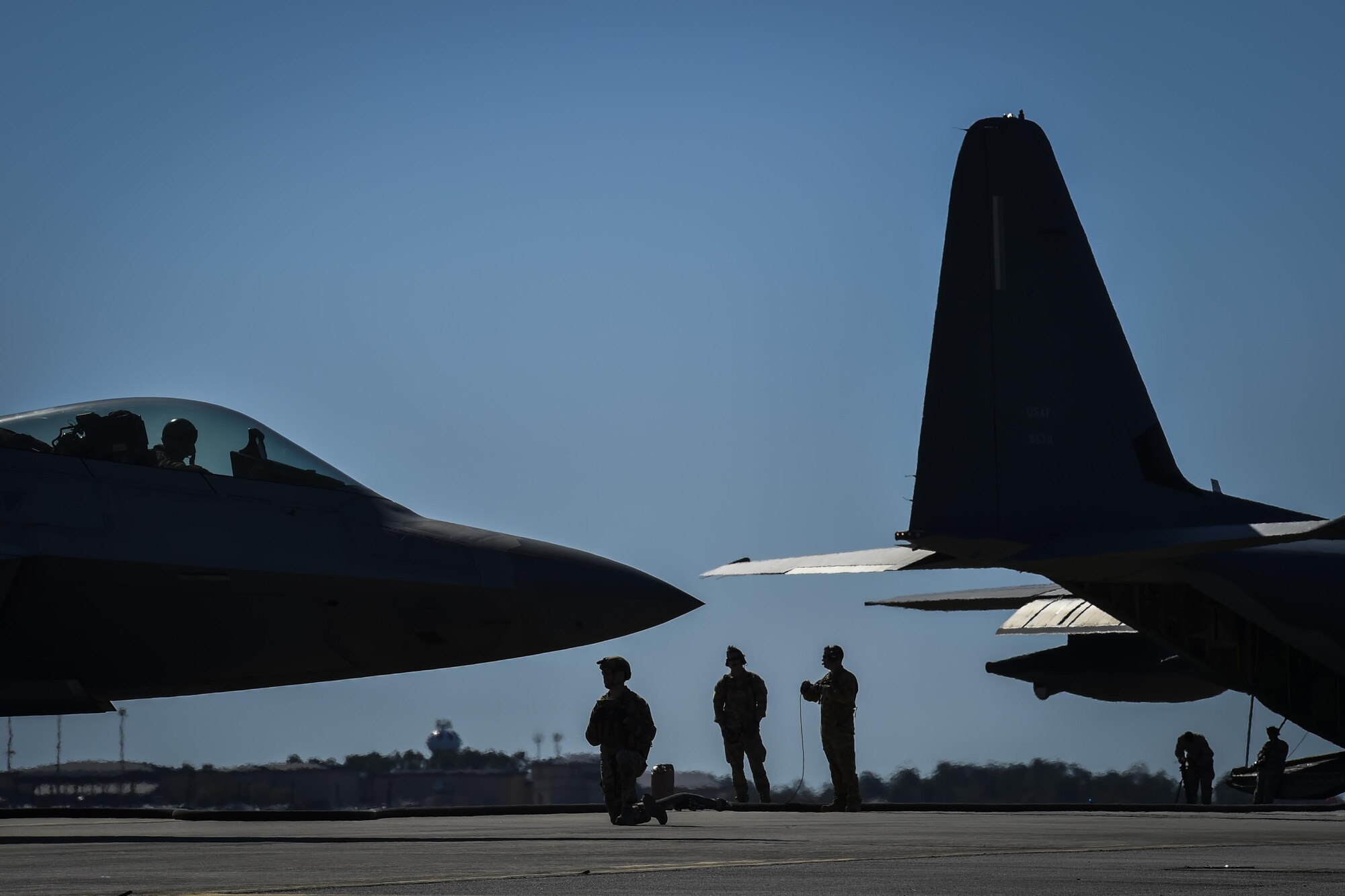 Forward area refueling point Airmen with the 1st Special Operations Logistic Readiness Squadron conduct a FARP operation at Hurlburt Field, Fla., Feb. 26, 2017. The FARP program is a United States Special Operations Command initiative that trains petroleum, oils and lubrication Airmen to perform covert, nighttime refueling operations in deployed locations where fueling stations are not accessible or when air-to-air refueling is not possible. FARPs provide the ability to ensure an aircraft’s global reach capabilities are met to accomplish the mission. Three F-22 Raptors assigned to the 95th Fighter Squadron, Tyndall Air Force Base, Fla., received fuel from an MC-130J Commando II tanker assigned to the 9th Special Operations Squadron, Cannon AFB, N.M. (U.S. Air Force photo by Airman 1st Class Joseph Pick)