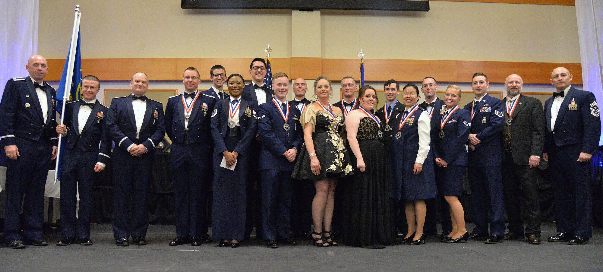 Col. Ron Allen, 341st Missile Wing commander, far left, and Chief Master Sgt. Thom Stiles, 341st MW command chief, far right, pose for a photo with the 341st MW Annual Award winners at the Grizzly Bend Feb. 25, 2017, at Malmstrom Air Force Base, Mont. Annual Award recipients represent the wing’s finest from all facets across the base; from junior airman of the year to spouse of the year. (U.S. Air Force photo/Airman 1st Class Magen M. Reeves)