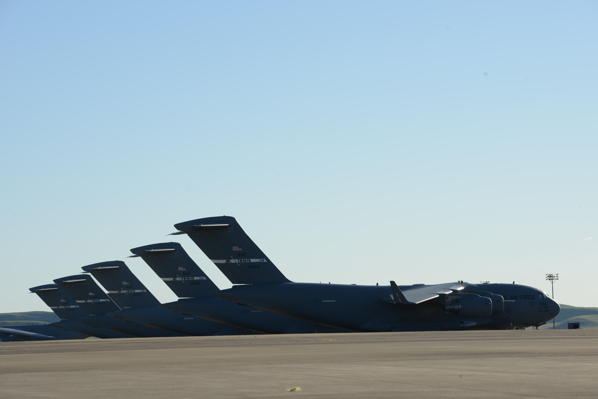 Several Air Force C-17 Globemaster III aircraft rest on the air field at Travis Air Force Base, Calif., Jan. 27, 2017. Travis aircraft support the USS Ronald Reagan by transporting parts and supplies to the ship when needed. (U.S. Navy photo by Chief Mass Communication Specialist Xander Gamble/Released)