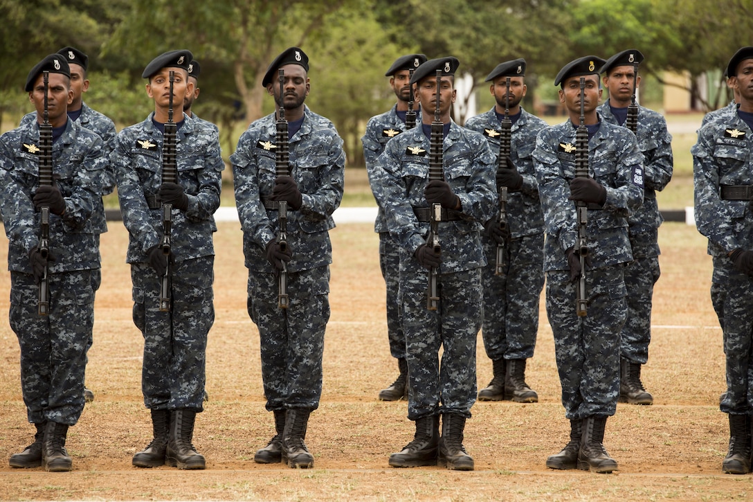 Sri Lankan Marines present arms during the Sri Lankan Marine Corps Boot Camp graduation at Sri Lankan Naval Station Barana in Mullikulum, Sri Lanka, Feb. 27, 2017. The ceremony marked the creation of the first Sri Lankan Marines; the SLMC will be an expeditionary force with specific missions of humanitarian assistance, disaster relief and peacekeeping support.