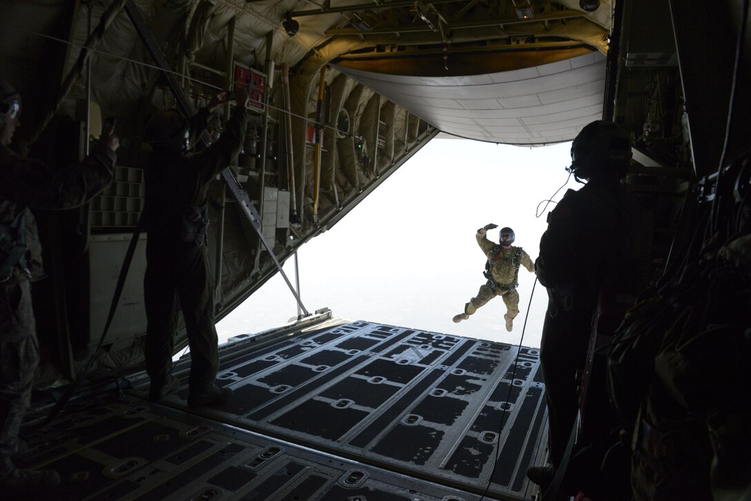 A U.S. Air Force combat controller from the 353rd Special Operations Group, Kadena Air Base, Japan exits a U.S. Air Force C-130J Super Hercules during a freefall jump with India Special Forces paratroopers during Aero India 2017 at Air Force Station Yelahanka, Bengaluru, India, Feb. 16, 2017. Jumpers from the two countries shared best practices and combined into jump teams, to the delight of the crowd. The U.S. participates in air shows and other regional events to demonstrate its commitment to the security of the Indo-Asia-Pacific region, promote the standardization and interoåperability of equipment, and display capabilities critical to the success of current and future military operations.  (U.S. Air Force photo by Capt. Mark Lazane)