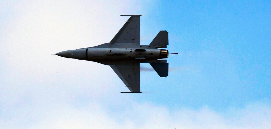 A U.S. Air Force F-16 Fighting Falcon performs an aerial maneuver as part of the Pacific Air Forces Aerial Demonstration Team during the opening ceremonies of Aero India 2017 at Air Force Station Yelahanka, India Feb. 14. In addition to the F-16, the U.S Department of Defense supported Aero India with a U.S. Navy P-8 Poseidon and a U.S. Air Force C-130 J Super Hercules, which supported a joint U.S. and Indian Air Force parachute jump later in the week. The United States participates in air shows and other regional events to demonstrate its commitment to the security of the Indo-Asia-Pacific region, promote the standardization and interoperability of equipment, and display capabilities critical to the success of current and future military operations. The F-16 is a compact, multi-role fighter aircraft. It is highly maneuverable and has proven itself in air-to-air combat and air-to-surface attack. It provides a relatively low-cost, high-performance weapon system for the United States and allied nations. (U.S. Air Force photo by Capt. Mark Lazane)