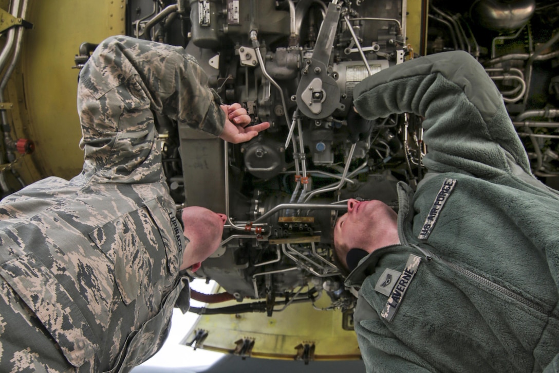 Air Force Staff Sgt. Travis Laverne, right, and Airman 1st Class Joseph Lupinacci troubleshoot an F108 engine on a KC-135 Stratotanker at Joint Base McGuire-Dix-Lakehurst, N.J., Feb. 26, 2017. Laverne and Lupinacci are engine mechanics assigned to the New Jersey Air National Guard's 108th Wing. Air National Guard photo by Master Sgt. Matt Hecht