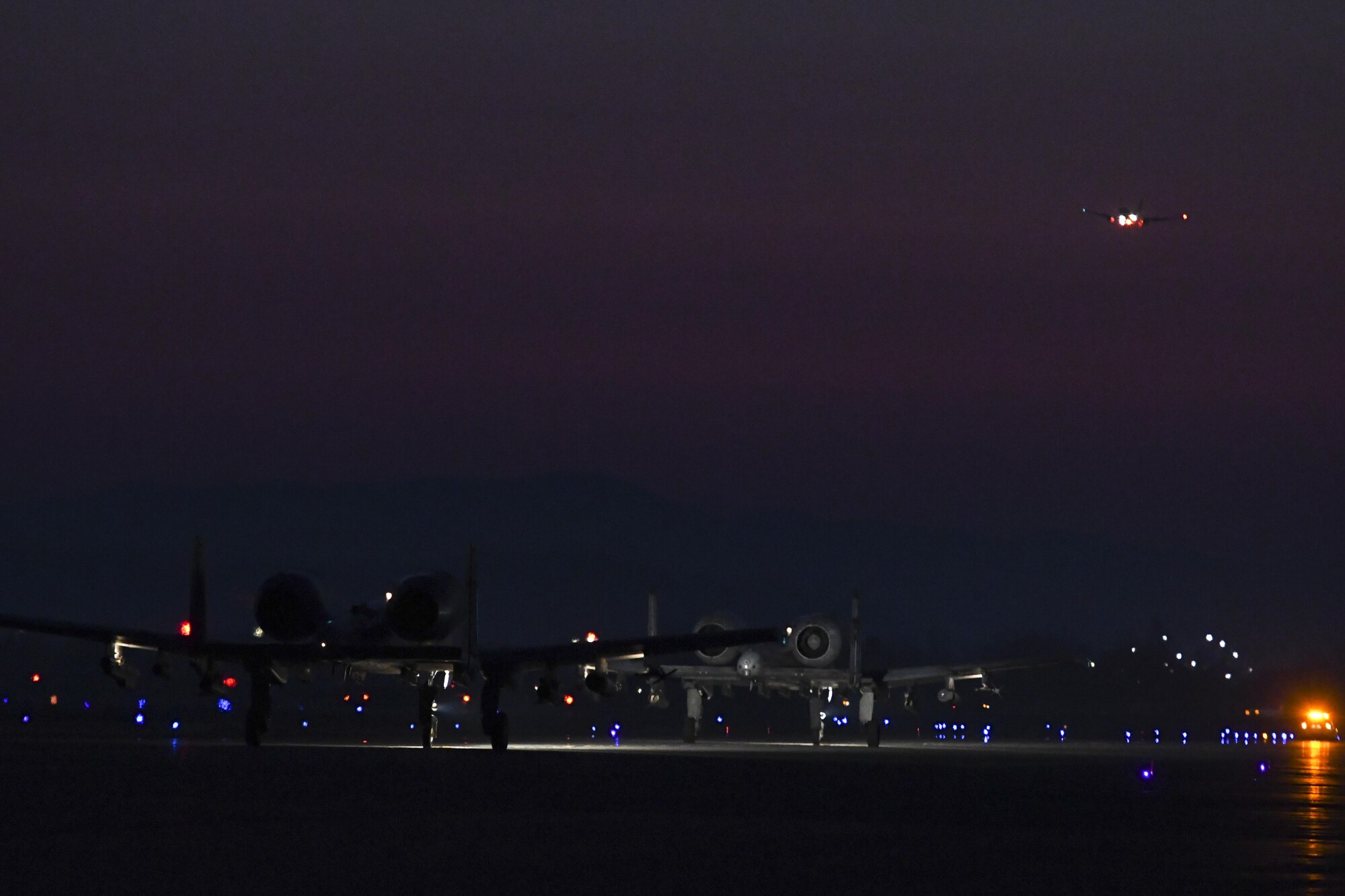 Two A-10 Thunderbolt IIs assigned to the 25th Fighter Squadron taxi out for a training mission during Exercise Beverly Herd 17-1 at Osan Air Base, Republic of Korea, Feb. 28, 2017. Beverly Herd is a routine training exercise held to increase the confidence, capabilities and cohesion of Team Osan forces to execute contingency operations. (U.S. Air Force photo by Staff Sgt. Victor J. Caputo)