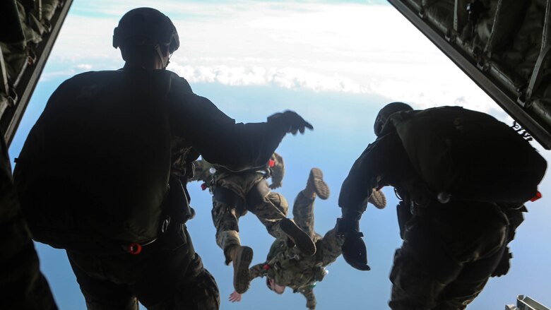 Marines dive from the back of a Lockheed C-130 Hercules at Marine Corps Auxiliary Landing Field Bouge,North Carolina, Feb. 23, 2017. These Marines conducted high-altitude free fall jumps as part of their yearly training for combat parachute operations. The Marines are with 2nd Reconnaissance Battalion. 