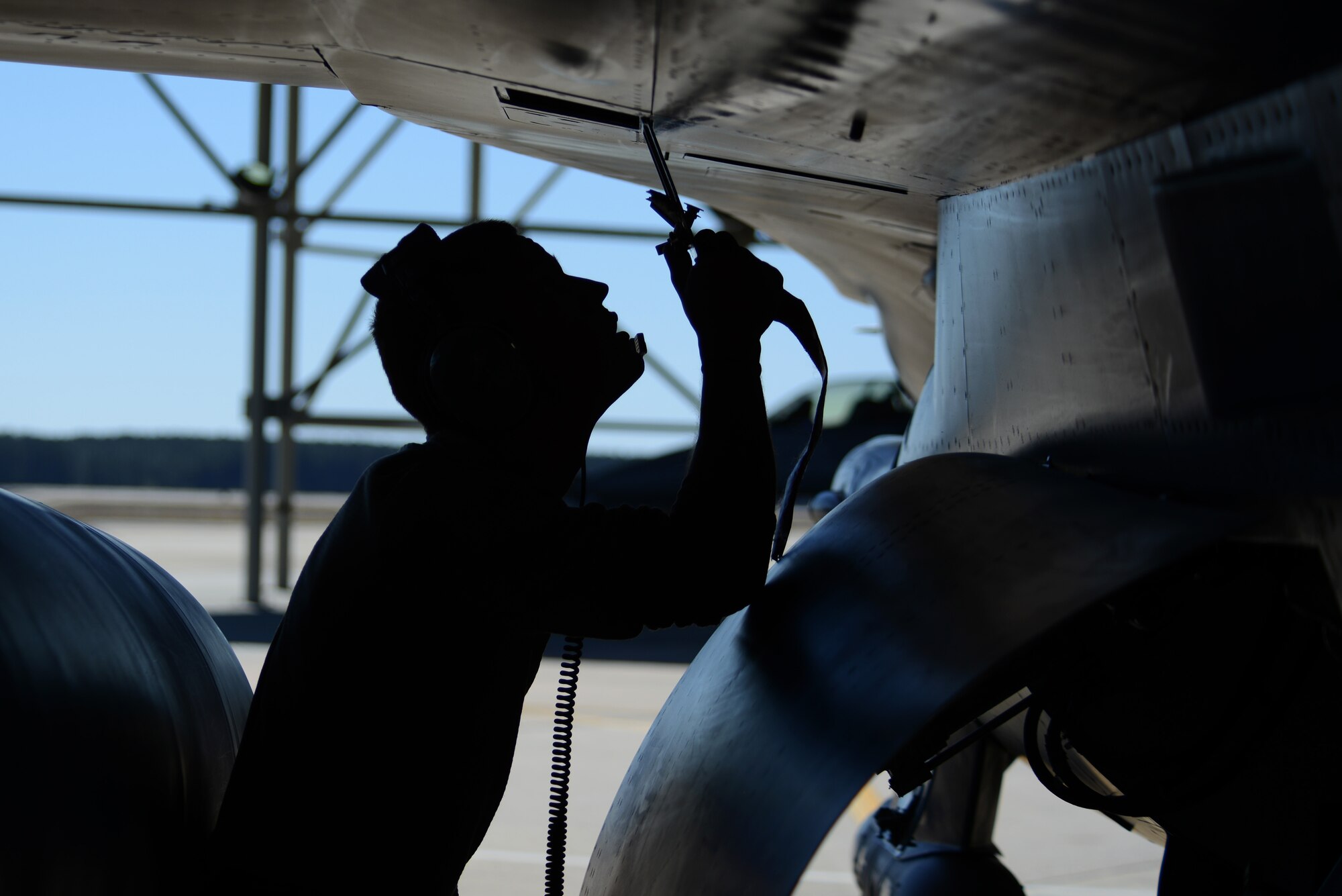 A U.S. Airman assigned to the 20th Aircraft Maintenance Squadron performs post-flight checks on an F-16CM Fighting Falcon at Shaw Air Force Base, S.C., Feb. 26, 2017. The 77th Fighter Squadron performed a missing man formation over Arlington National Cemetery, Virginia, in honor of retired Air Force Col. Thomas Schaefer, who spent 444 days as a captive. (U.S. Air Force photo by Airman 1st Class Kelsey Tucker)