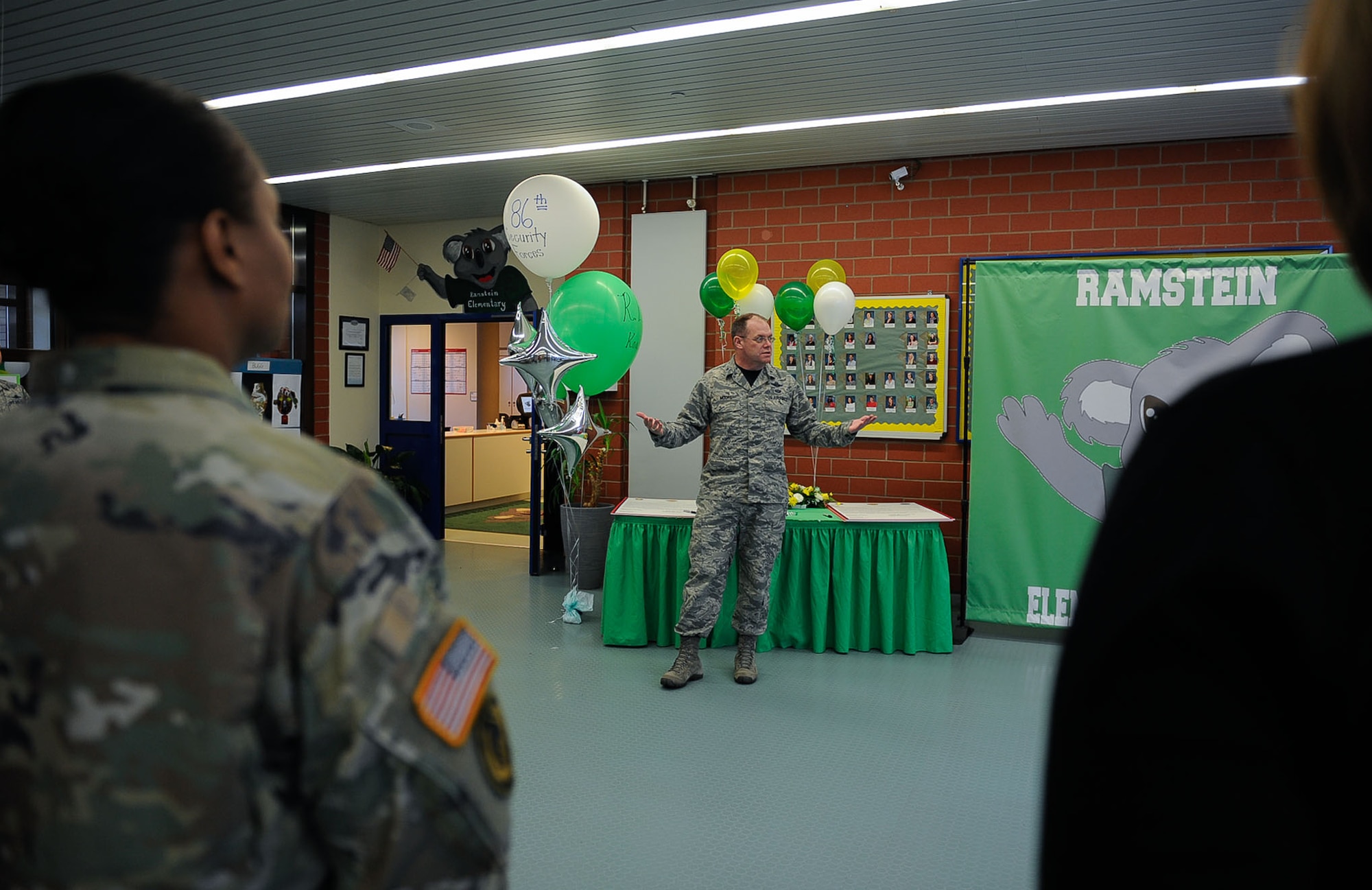 Brig. Gen. Richard Moore, 86th Airlift Wing commander, speaks at an Adopt-a-School Program signing at Ramstein Elementary School on Ramstein Air Base, Germany, Feb. 24, 2017. The Adopt-a-School program is a voluntary, ongoing partnership between a school and a military unit that increases public awareness of the military’s mission and enhances military children’s quality of education. (U.S. Air Force photo by Airman 1st Class Savannah L. Waters)