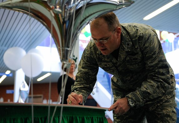 Brig. Gen. Richard Moore, 86th Airlift Wing commander, signs a Memorandum of Understanding for the Adopt-a-School Program at Ramstein Elementary School on Ramstein Air Base, Germany, Feb. 24, 2017. The program includes activities such as mentoring, supplementing classroom learning experiences, campus beautification projects, leading students in weekly PT sessions, and afterschool activity sponsorship in the Kaiserslautern Military Community. (U.S. Air Force photo by Airman 1st Class Savannah L. Waters)