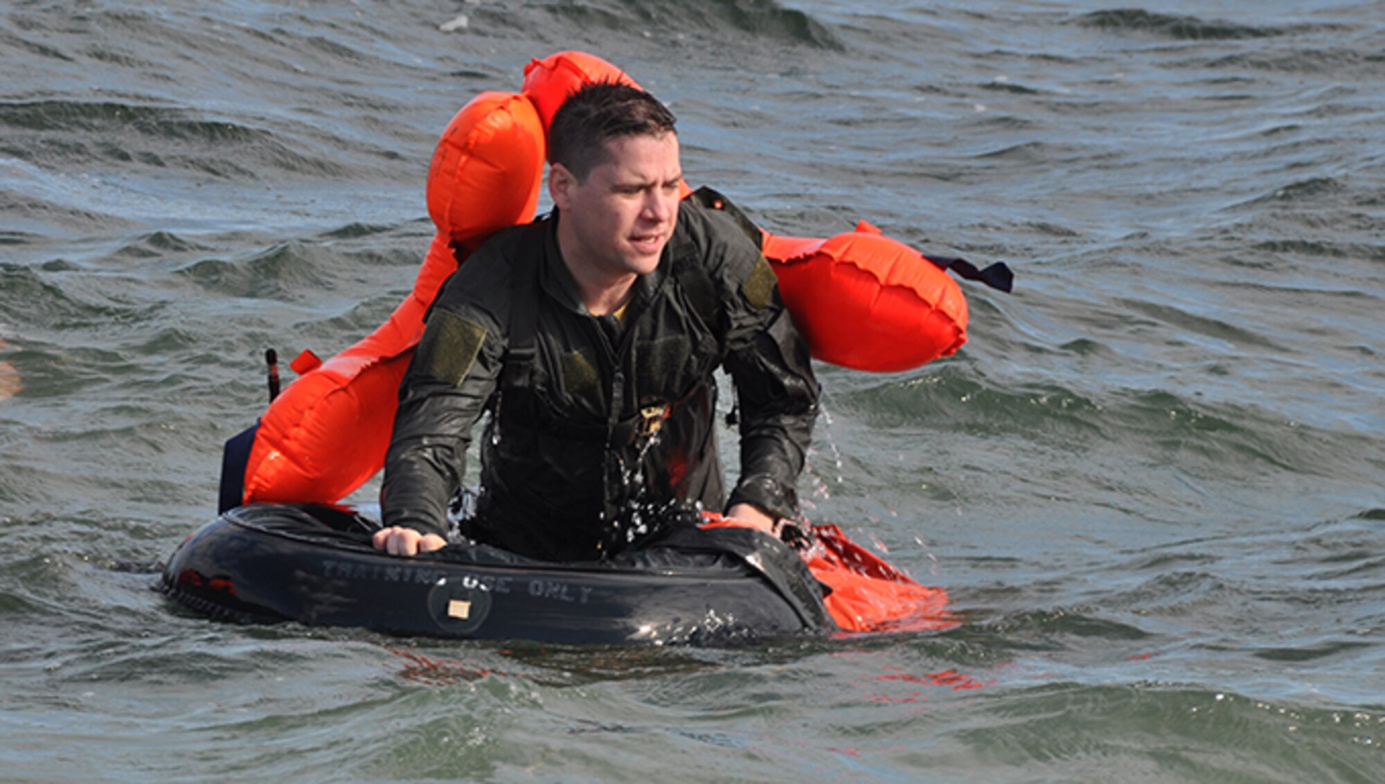 Senior Airman Josh Stubbs, 700th Airlift Squadron loadmaster, participates in Water Survival Training at Naval Air Station Key West, Florida February 23, 2017. During the two-day Survival, Evasion, Resistance and Escape course, members also completed Self Aid Buddy Care and combat survival. According to Col. Patrick Campbell, 94th Operations Group commander, this marks the first time this training has completed by aircrew, aeromedical and aircrew flight equipment personnel at the same time. (U.S. Air Force photo/Master Sgt. James Branch)
