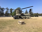 A CH-47 Chinook helicopter from JTF-Bravo's 1st Battalion, 228 Aviation Regiment unloads a pallet of equipment and supplies during a deployment readiness exercise of the U.S. Southern Command Situational Assessment Team (SSAT) in Zambrano, Honduras, Feb. 21 through 23. The SSAT is a quick-reaction deployable team comprised of experts that provide the commander of USSOUTHCOM an immediate assessment of conditions and unique Department of Defense requirements which might be needed during a Humanitarian Assistance, Disaster Response event within the Central American Area of Responsibility.